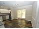 Kitchen dining area with hardwood floors and large window at 500 W Woodcroft Pkwy Pkwy # 8C, Durham, NC 27713