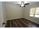 Spacious bedroom with dark laminate wood flooring and ceiling fan at 500 W Woodcroft Pkwy Pkwy # 8C, Durham, NC 27713