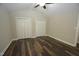 Bedroom with hardwood floors, double closets and ceiling fan at 500 W Woodcroft Pkwy Pkwy # 8C, Durham, NC 27713