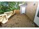Wooden deck with storage shed and leafy trees background at 500 W Woodcroft Pkwy Pkwy # 8C, Durham, NC 27713