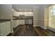 Kitchen with white cabinets, granite countertops, and stainless steel appliances at 500 W Woodcroft Pkwy Pkwy # 8C, Durham, NC 27713