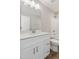 White bathroom vanity with nickel fixtures and a wood-look floor at 7814 Nc 27, Coats, NC 27521