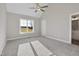 Large bedroom with vaulted ceiling, carpet, and bright window at 7814 Nc 27, Coats, NC 27521