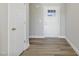 Bright and airy entryway with wood-look flooring and a white front door at 7814 Nc 27, Coats, NC 27521
