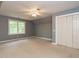 Bedroom with carpet flooring, ceiling fan and double closets at 363 Dublin Dr, Sanford, NC 27330