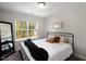 Bedroom with king-size bed and large window at 209 Highland Forest Dr, Fuquay Varina, NC 27526