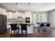 Modern kitchen with white cabinets, granite countertops, and island seating at 209 Highland Forest Dr, Fuquay Varina, NC 27526