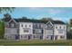 Modern three-story townhome with gray siding and a charming front yard at 758 Dorset Stream Dr, Fuquay Varina, NC 27526
