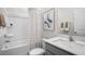 Clean bathroom with a tub, shower, toilet, and vanity with a quartz countertop at 758 Dorset Stream Dr, Fuquay Varina, NC 27526