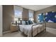 Bedroom with a metal bed frame, nightstands and large artwork at 758 Dorset Stream Dr, Fuquay Varina, NC 27526