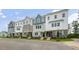 New townhome community featuring 3-story townhouses with various exterior finishes at 758 Dorset Stream Dr, Fuquay Varina, NC 27526