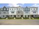 New townhome community featuring 3-story townhouses with various exterior finishes at 758 Dorset Stream Dr, Fuquay Varina, NC 27526
