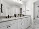 Modern bathroom with double vanity, gray countertops, and a large mirror at 116 E Star Foal Ln, Wendell, NC 27591