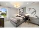 Bright bedroom with a gray bed, built-in desk, and baseball-themed wall art at 116 E Star Foal Ln, Wendell, NC 27591