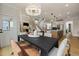 Dining area with a large table, chandelier, and access to the kitchen at 116 E Star Foal Ln, Wendell, NC 27591