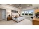 Spacious main bedroom with large windows, plush carpeting, and an ensuite bathroom at 116 E Star Foal Ln, Wendell, NC 27591