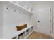 White mudroom with bench seating and storage at 116 E Star Foal Ln, Wendell, NC 27591