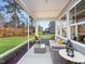 Relaxing screened porch with outdoor seating at 412 Cresting Wave Dr, Wake Forest, NC 27587