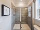 Shower with glass enclosure and gray tile at 412 Cresting Wave Dr # 387, Wake Forest, NC 27587