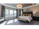 Spacious bedroom with a large bed, plush carpet, and abundant natural light at 2925 Hanging Valley Way # 397, Wake Forest, NC 27587