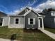 Modern gray house with stone accents and landscaping at 804 Dorset Stream Dr, Fuquay Varina, NC 27526