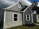 Modern gray house with stone accents and landscaping at 804 Dorset Stream Dr, Fuquay Varina, NC 27526
