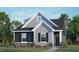 Two story home with gray and blue siding, stone accents, and landscaping at 804 Dorset Stream Dr, Fuquay Varina, NC 27526