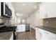 Open concept kitchen with stainless steel appliances and granite countertops at 804 Dorset Stream Dr, Fuquay Varina, NC 27526