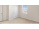 Charming bedroom with carpeted floors and a window at 804 Dorset Stream Dr, Fuquay Varina, NC 27526