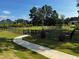 Community dog park with fenced area, waste disposal, and walking path at 804 Dorset Stream Dr, Fuquay Varina, NC 27526