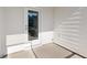 Screened porch with a glass door, white siding, and concrete flooring at 804 Dorset Stream Dr, Fuquay Varina, NC 27526