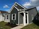 Modern gray house with stone accents and landscaping at 804 Dorset Stream Dr, Fuquay Varina, NC 27526