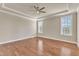 Spacious bedroom with hardwood floors and natural light at 2551 Club Level Dr, Apex, NC 27523