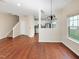 Open dining room with hardwood floors and kitchen views at 330 Gilman Ln # 106, Raleigh, NC 27610