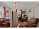 Bedroom with hardwood floors and two chairs at 813 Tucker St, Burlington, NC 27215