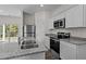 Modern kitchen with stainless steel appliances and granite countertops at 240 Babbling Brook Dr, Clayton, NC 27520