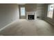 Living room with fireplace and built-in shelving at 81 Seahawk Way, Zebulon, NC 27597