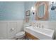 Stylish powder room with pedestal sink and decorative wallpaper at 32430 Archdale, Chapel Hill, NC 27517