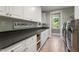 Laundry room with ample cabinetry and countertop space at 32430 Archdale, Chapel Hill, NC 27517