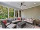 Relaxing screened porch with wicker furniture and ceiling fan at 32430 Archdale, Chapel Hill, NC 27517