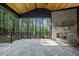 Stone patio with a fireplace and wooded view at 7800 Ailesbury Rd, Wake Forest, NC 27587