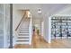 Light-filled entryway with hardwood floors and staircase at 4638 Apple Ridge Ln, Graham, NC 27253