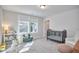 bedroom with crib, armchair, and window at 4638 Apple Ridge Ln, Graham, NC 27253