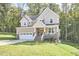 Two story house with stone accents and a two car garage at 4638 Apple Ridge Ln, Graham, NC 27253