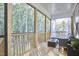 Relaxing screened porch with wood flooring and seating at 4638 Apple Ridge Ln, Graham, NC 27253