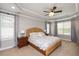 Bright and airy bedroom with a wicker bed frame and ample natural light at 175 Jacqueline Dr, Willow Springs, NC 27592