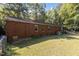 Side view of brick home with large backyard at 118 W Silver Belle Dr, Zebulon, NC 27597