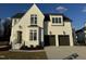 Stunning two-story home with white brick exterior and two-car garage at 909 Lily Claire Ln, Fuquay Varina, NC 27526