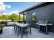Modern rooftop deck features a dining table and built-in grill at 1511 Malta Ave, Raleigh, NC 27610