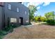 Dark gray home with a walkway and landscaping at 1511 Malta Ave, Raleigh, NC 27610